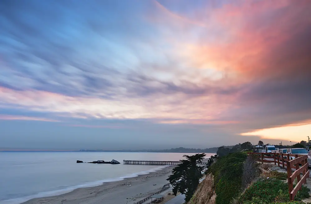 Seacliff State Beach with pier and SS Palo Alto at sunset during wildfires to show one of the best Californian beaches located in Santa Cruz