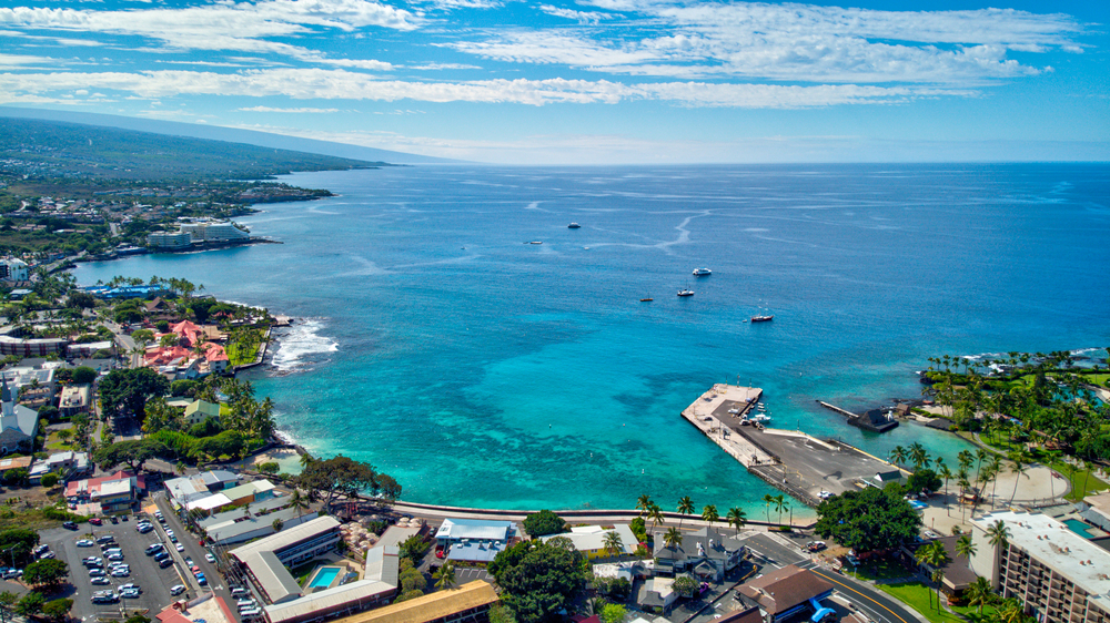 Alii Drive aerial view in Kailua Kona on a beautiful day during the best time to visit Kona for a frequently asked questions section