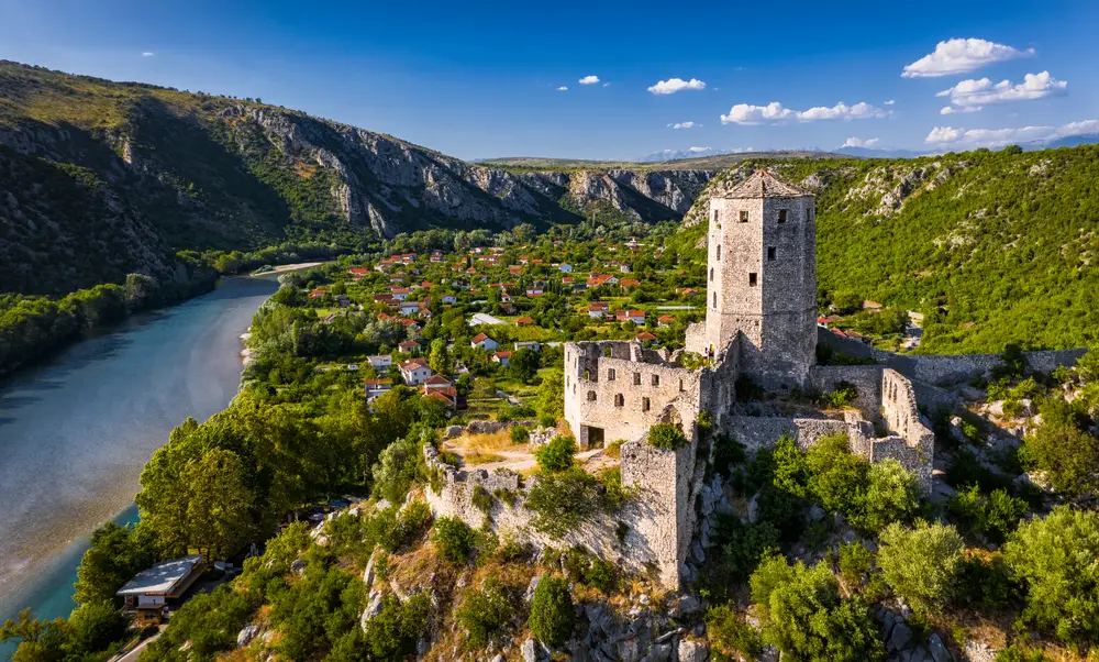 Town on the hill, Počitelj, featuring a medieval fortress during the warm summer months in the best time to visit Bosnia