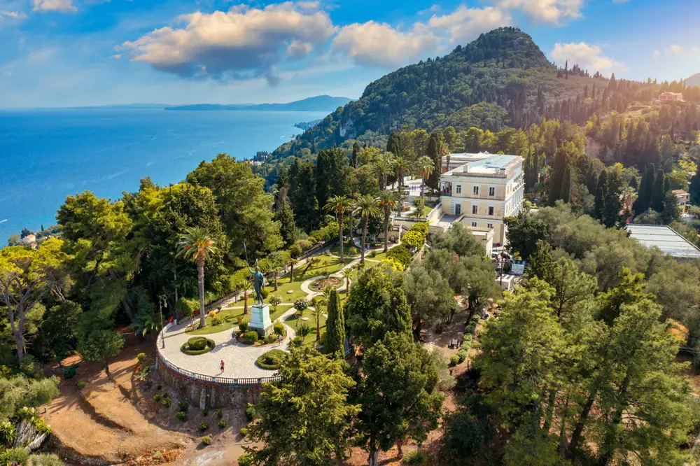 Aerial drone shot of the Achilleion Palace in Corfu in Agios Gordios, a top pick when thinking about where to stay in Corfu