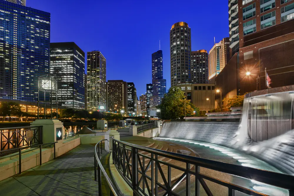 Floodlit Centennial Fountain pictured along the riverwalk in Chicago, one of the best areas to stay when visiting the city