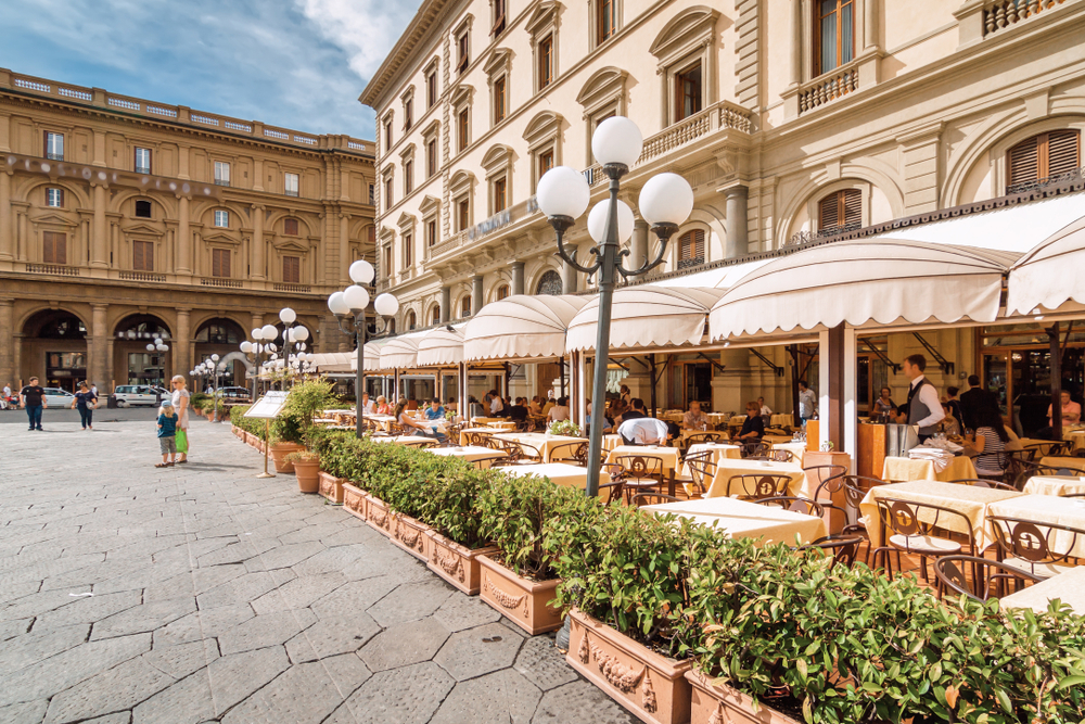 Piazza della Repubblica street cafe view during the late summer, the worst time to visit Florence with hot temperatures