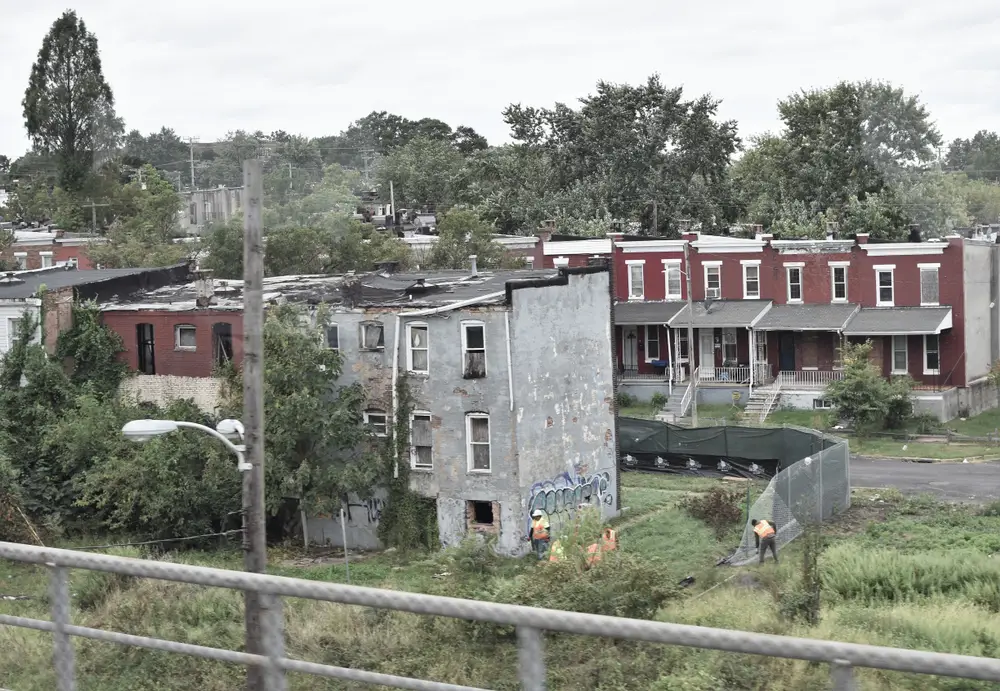 Cherry Hill neighborhood in Baltimore, one of the least safe areas in the city, pictured with a few slum-like homes boarded up