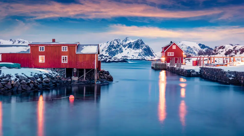 Unique over-water huts in Ballstad pictured on the Lofoten Islands for a guide to whether or not Norway is safe