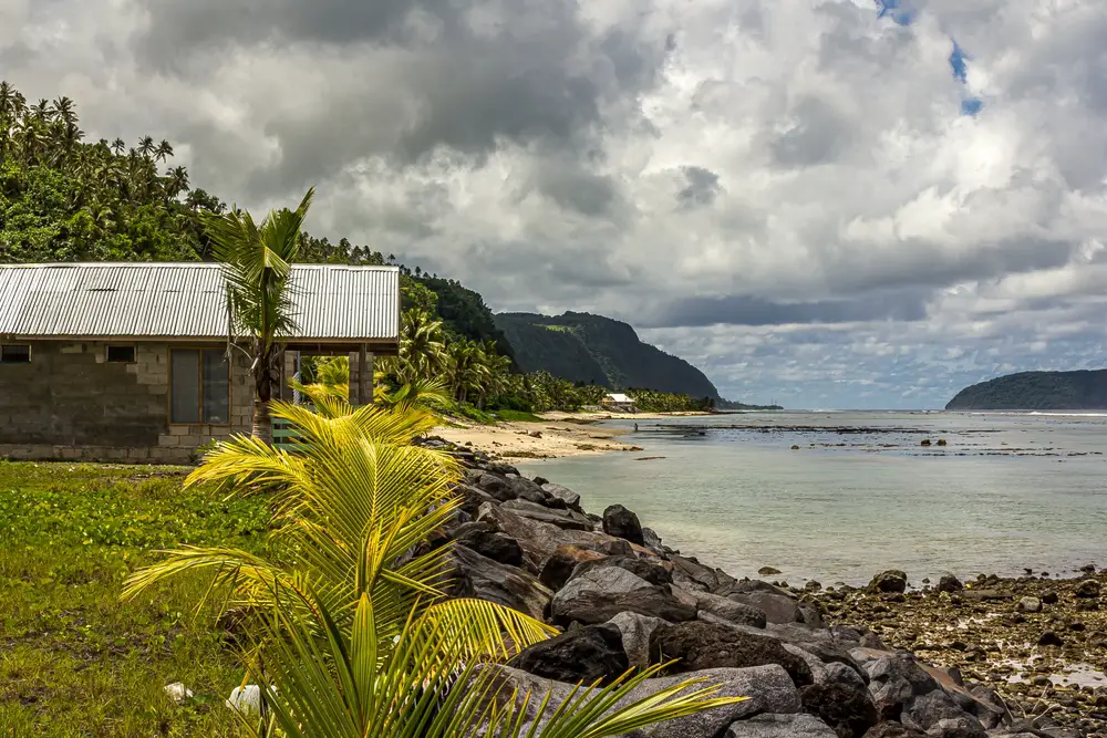Neat view of the Upolu Island in Samoa pictured on a cloudy day with a hut overlooking the ocean