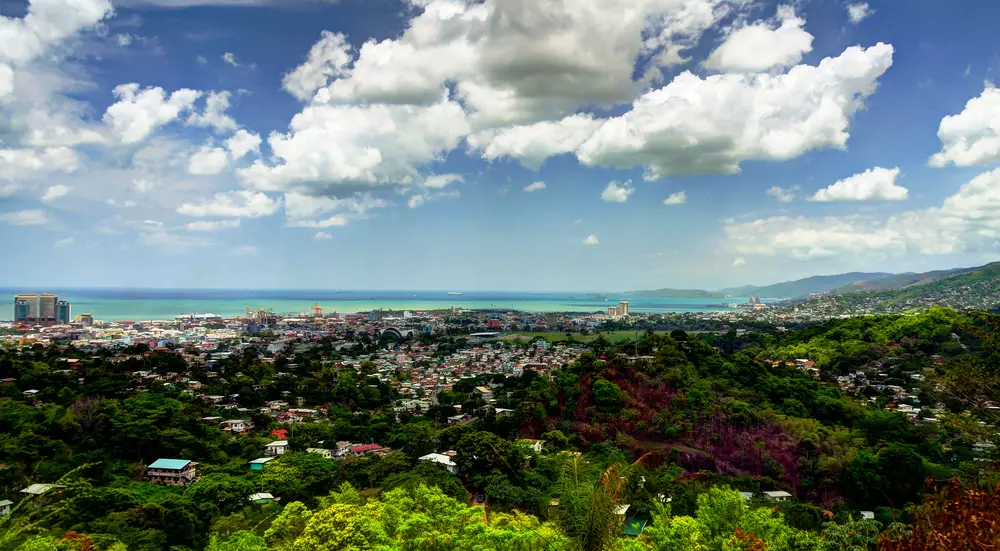 Aerial panoramic view of Port of Spain on a cloudy nice day for a frequently asked questions section covering the best time to visit Trinidad