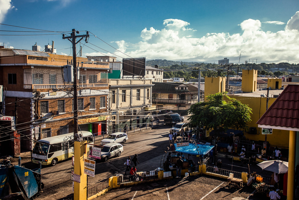 Bus and cars in the streets of Montego Bay pictured for a piece on whether or not the area is safe to visit on a blue sky day 