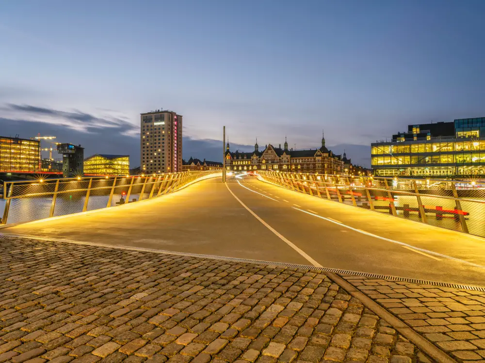 To show that Copenhagen is safe to visit, even at night, the well-lit Lille Langebro cycling bridge pictured over the city harbor