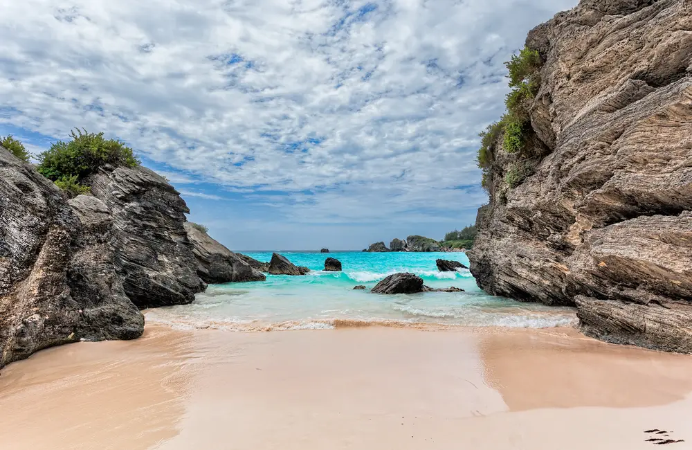 Very neat and secluded beach in the middle of two rocks showing that Bermuda is safe to visit