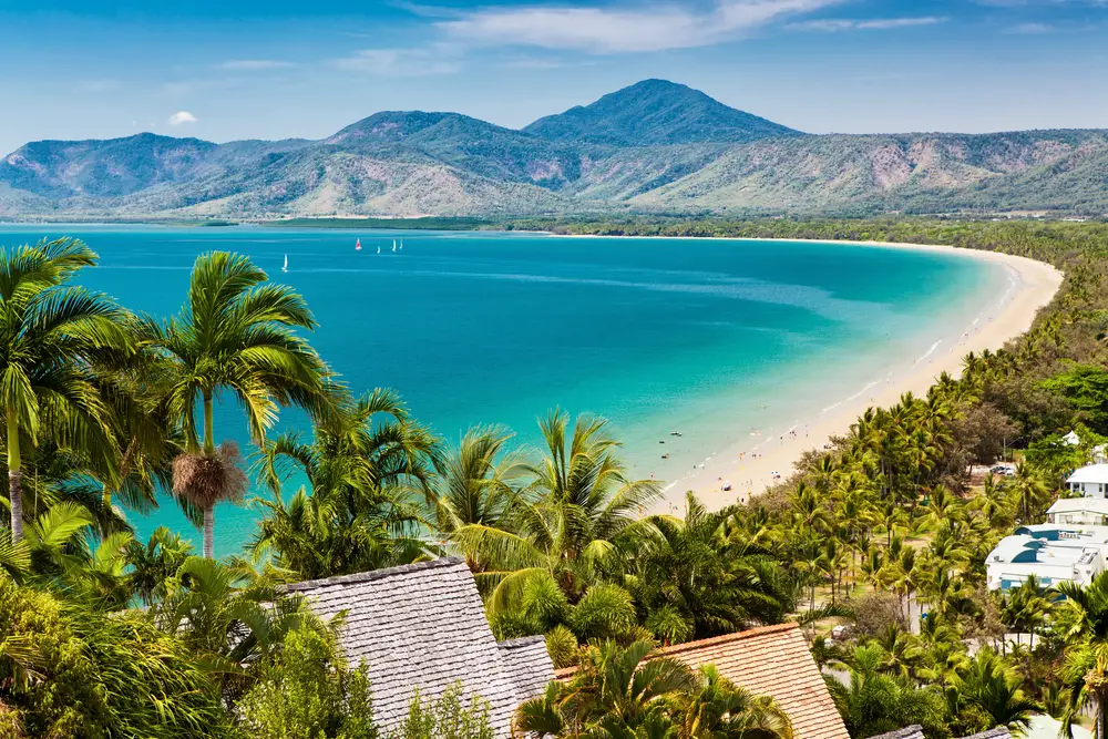 Aerial view of the expansive white sand beach of Port Douglas, one of our top picks for where to stay in Australia
