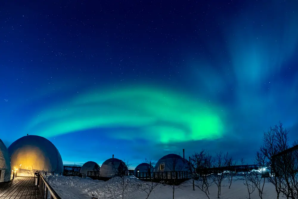 Glamping domes in Iceland under the Northern Lights in the winter makes for an excellent bucket list trip