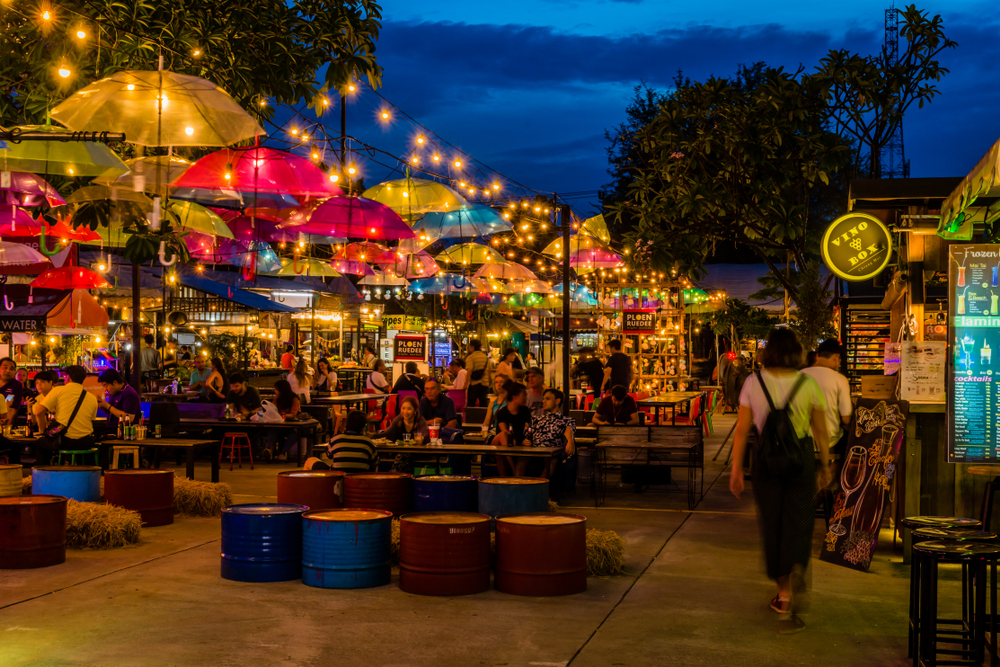Picturesque view of the little restaurants and shops at the night bazaar, one of the best areas to stay on a trip to Chiang Mai
