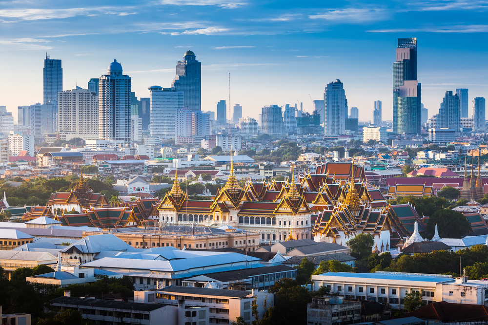 Aerial view of Bangkok, Thailand showing the Grand Palace and temples with skyscrapers behind for a list of the best tourist destinations in the world