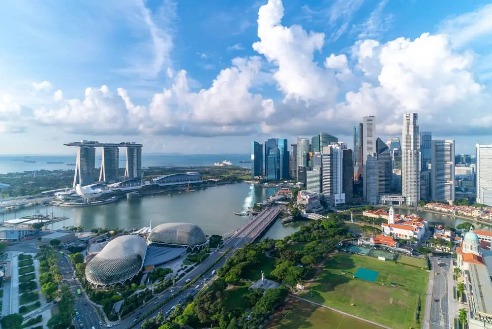 Aerial view of Singapore from Marina Bay with futuristic buildings on a nice spring day, ranked as one of the best places to visit in the world as a tourist