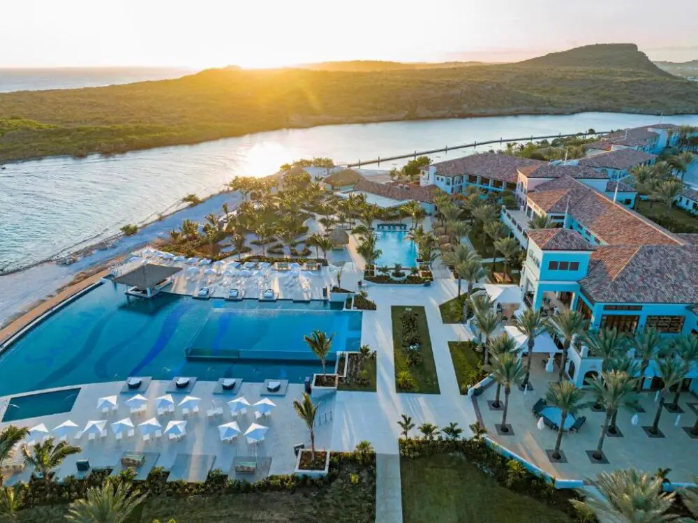 Aerial image of the pool and cabanas at Sandals Royal Curacao, one of the best Caribbean adults-only all-inclusive resorts
