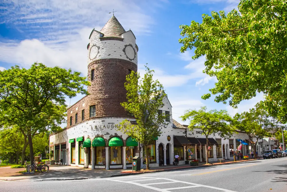 Photo of a tall brick building on the corner of downtown Southampton, one of the most expensive areas in the Hamptons