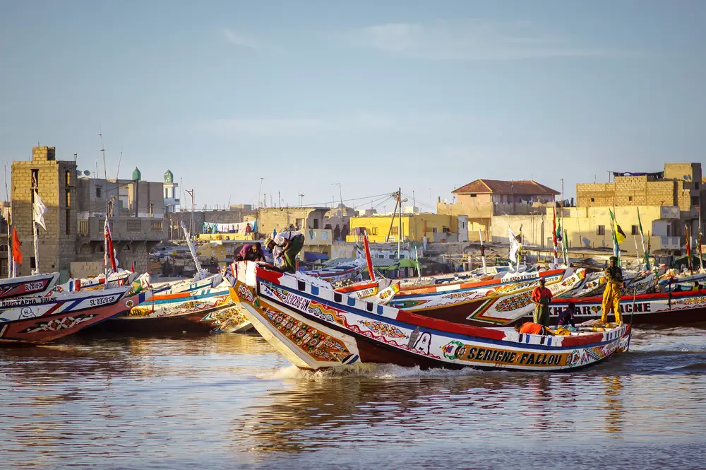 Photo of boats floating on the water in Saint Louis Senegal