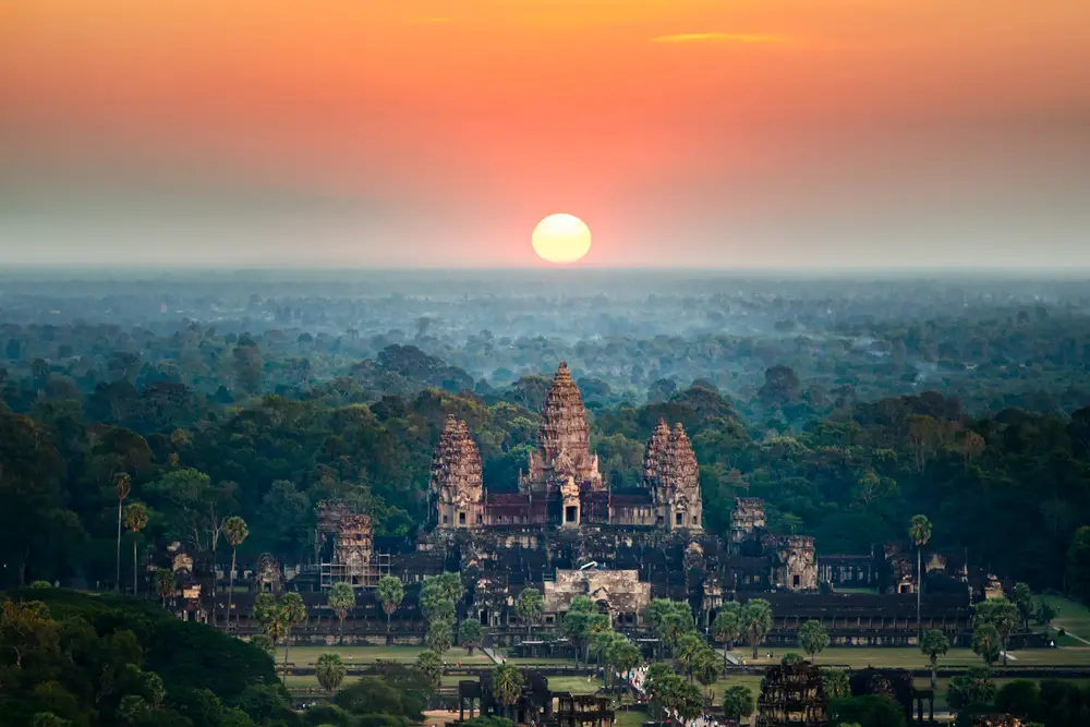 Aerial view of Angkor Wat in Siem Reap, Cambodia at sunset to show one of the best places for solo travelers to visit