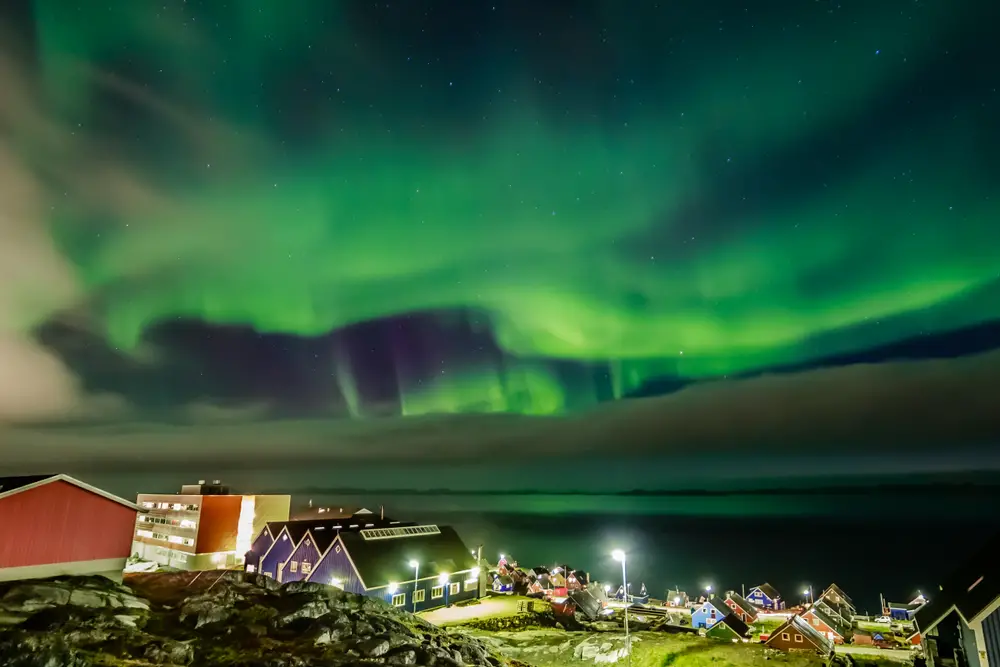 Northern lights pictured over the clouds in Nuuk