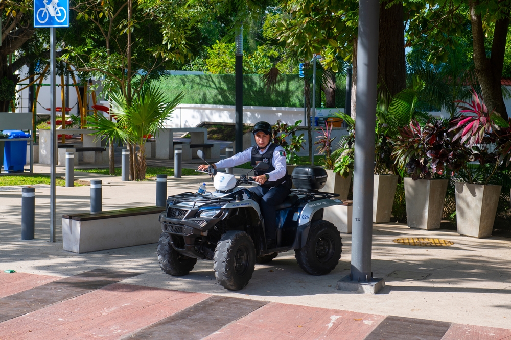 Photo of a police officer on an ATV pictured in one of the sketchy areas of Cancun