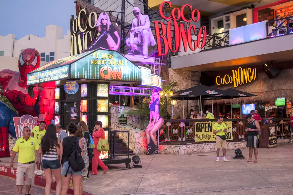 Photo of a street corner with Coco Bongo pictured for a guide titled Is cancun Safe to Visit, highlighting the areas you need to use caution in when visiting