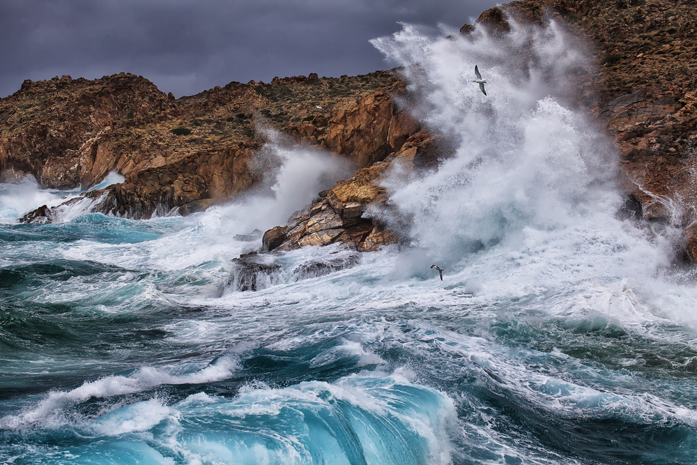 Huge waves crashing onto rocks on the island in Greece