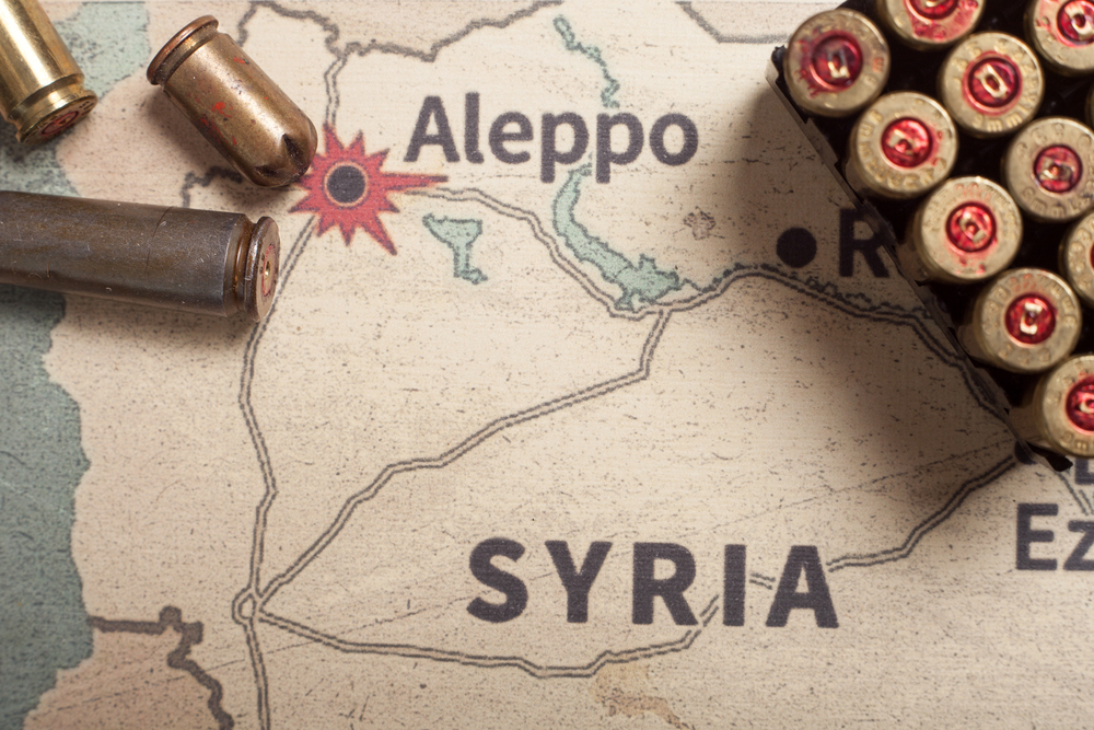 Έννοια της συριακής σύγκρουσης με σφαίρες τοποθετημένες σε χάρτη της χώρας για ένα άρθρο που διερευνά είναι η Συρία ασφαλής για επίσκεψη;