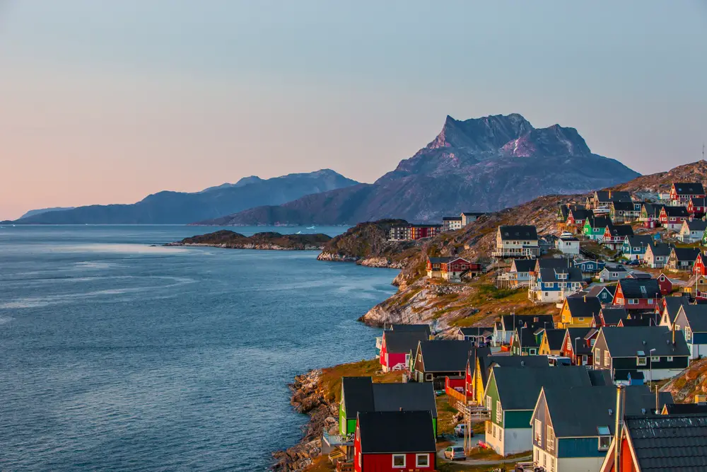 Hillside town of Nuuk on the west coast of Greenland pictured for a guide titled Is Greenland Safe to Visit