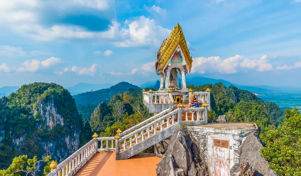 View of the top of the Tiger Cave Temple in the Krebi region of Thailand for a guide showing the average flight times to Thailand from the US