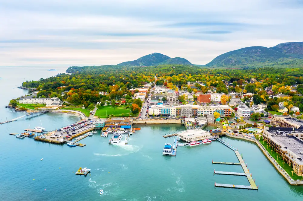 Aerial view of Bar Harbor with boats in the harbor on Mt. Desert Island, Maine in the summertime for a list ranking the best weekend trips in the Northeast US