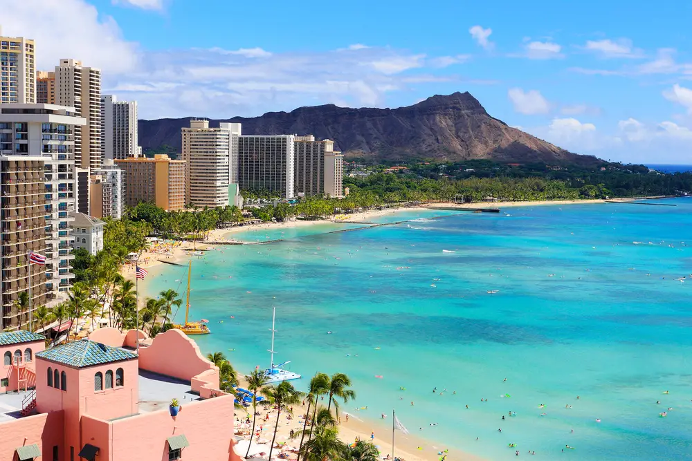View of Honolulu coastline with Diamond Head crater and Waikiki Beach during a nice day for a list ranking the top places to travel to without a passport